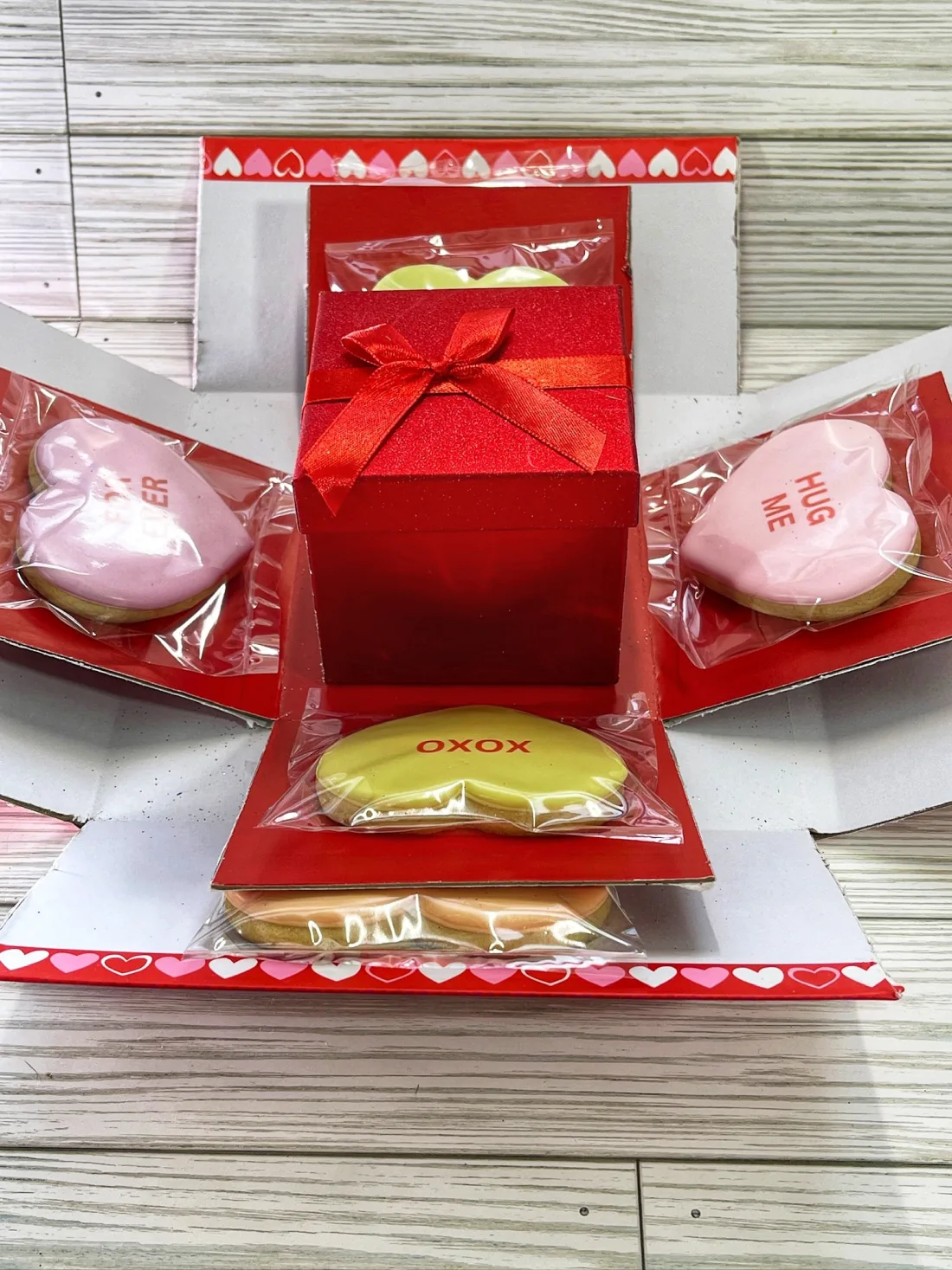 Valentine's Day cookie explosion box with decorated heart cookies