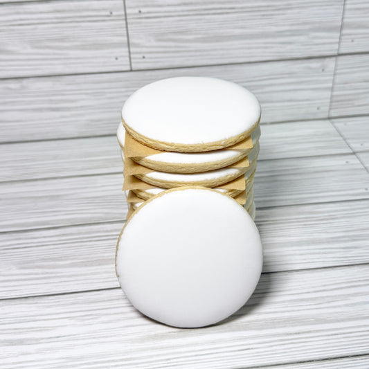 Stack of round vanilla sugar cookies iced with smooth white royal icing, ideal for edible image printing with Eddie printer or edible ink.