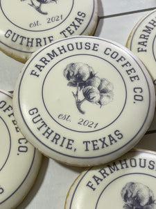 Round sugar cookie with Farmhouse Coffee Co from Guthrie, Texas printed on white icing.